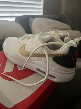 Nike woman’s White Sneakers with Gold Swoosh and Black Heel